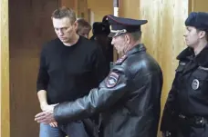  ?? SERGEI ILNITSKY, EUROPEAN PRESSPHOTO AGENCY ?? Russian opposition leader Alexei Navalny enters a courtroom to hear his verdict at the Tverskoy district court in Moscow on Monday, one day after his arrest on charges of resisting police orders and organizing a public gathering without a permit.