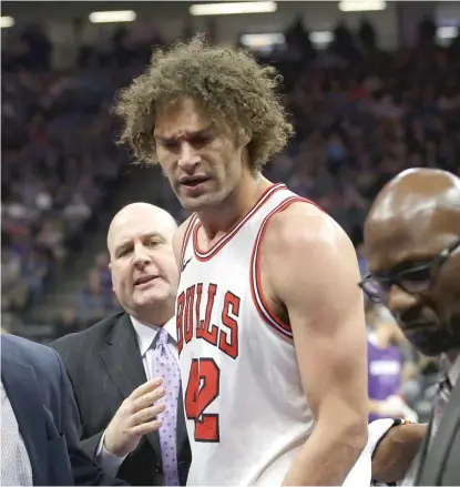  ??  ?? Bulls center Robin Lopez leaves the court after being ejected for receiving two technicals in the second quarter Monday.