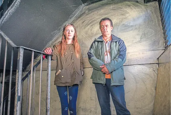  ?? Pictures: Kim Cessford. ?? Chloe O’Hare and her father Antony in the stairwell of the Lordburn Place block.