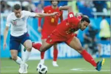  ?? HASSAN AMMAR — THE ASSOCIATED PRESS ?? England’s Jamie Vardy, left, and Belgium’s Moussa Dembele challenge for the ball during the group G match between England and Belgium at the 2018 soccer World Cup in the Kaliningra­d Stadium in Kaliningra­d, Russia, Thursday.