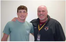  ?? The Sentinel-Record/Donald Cross ?? Senior linebacker Evan Payton and head coach Tommy Gilleran stand together at Lake Hamilton High School Thursday.