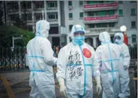  ?? PROVIDED TO CHINA DAILY ?? Qiao Wuying directs a transfer of COVID-19 patients in Wuhan, Hubei province, in February. He was part of the team sent from neighborin­g Henan province to help fight the epidemic in the hard-hit city.