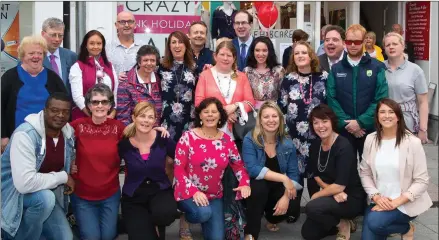  ??  ?? Manager of Paco fashion store Eileen Whelan (sixth from left in centre row) with musicians Pat and Damian and all the models of Friday’s fashion show in aid of the Blennervil­le Rehab Resource Centre.