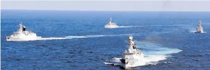  ?? Photo / AP ?? Chinese Navy vessels during a drill in the waters off Zhoushan in east China's Zhejiang province.