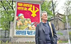  ??  ?? Propaganda abounds: Michael Palin was closely guarded in North Korea