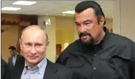  ?? BBC ?? SESAMA PENGGEMAR BELA DIRI: Vladimir Putin dan Steven Seagal.