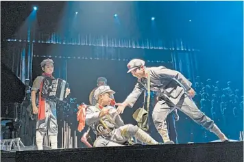  ?? ANNA FIFIELD/WASHINGTON POST ?? Children from Dengshikou Elementary in Beijing perform “Little Red Army” at the Chinese National Theatre for Children.