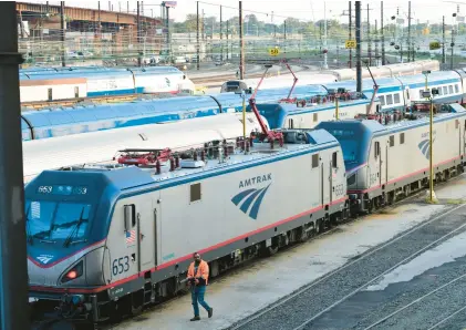  ?? MARK MAKELA/THE NEW YORK TIMES ?? Amtrak trains outside the 30th Street Station in Philadelph­ia. Lehigh Valley officials are looking at restoring passenger train service between the area and Philadelph­ia and/or New York City.