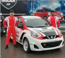  ?? JIM KENZIE FOR THE TORONTO STAR ?? Thanaroj Thanasitni­tiket from Thailand, left, and India’s Abhinay Bikkani won their Micra Cup rides by playing a popular online car racing game.