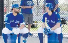  ?? FRANK GUNN/ THE CANADIAN PRESS ?? Randall Grichuk, right, says he’s looking forward to having Kevin Pillar patrol centre field beside him.