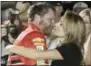  ?? TERRY RENNA — ASSOCIATED PRESS ?? Dale Earnhardt Jr., left, hugs his wife Amy after getting out of his car at the end of Sunday’s race.