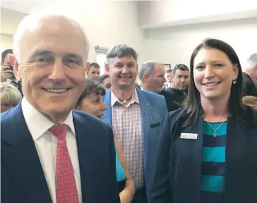  ??  ?? Prime Minister Malcolm Turnbull announces the Warragul early learning centre $800,000 funding boost to Baw Baw Shire chief executive officer Alison Leighton in Traralgon on Thursday. Cr Michael Leaney is in the background.