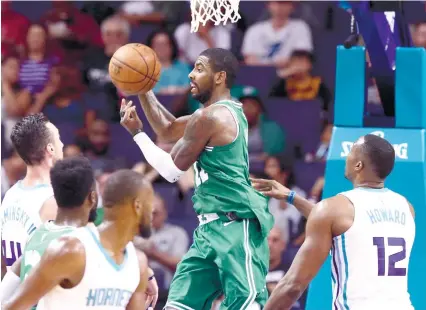  ?? AP FOTO ?? UNBEATEN. Kyrie Irving of th Boston Celtics (center) leads the team to an unbeaten preseason with 16 points.
