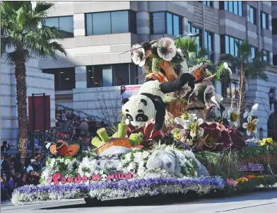  ?? ZHANG SHUO / CHINA NEWS SERVICE ?? A panda-themed float makes its way along the parade route at the 129th Rose Parade in Pasadena, California, on Monday. The theme of the 2018 parade was “Making a Difference”.