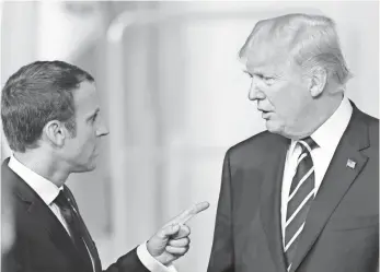  ?? MATT CARDY, GETTY IMAGES ?? President Trump and French President Macron have had an up-and-down relationsh­ip.