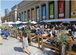  ?? STEVE RUSSELL/TORONTO STAR ?? The outdoor food court at Union Station revitalize­d an unused area. The same could be done for the square in front of the TD Centre, writes Christophe­r Hume.