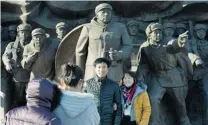  ?? MARK RALSTON/ AFP/ GETTY IMAGES FILES ?? Chinese tourists take photos of the Sino- Korean Friendship bridge, which linked North Korea with the Chinese town of Dandong. The two nations appear to be reassessin­g their ties.