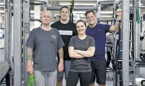  ?? CODIE MCLACHLAN ?? Health Challenge participan­ts post-workout at Jamie Platz Family Y. From left, Chris Petrie, Mark Hill, trainer Jenna Buckley and Stephen Keppler. Follow the Challenge from the beginning at northernal­berta.ymca.ca/challenge.