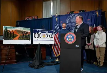  ?? PHOTO COURTESY OF DEREK KUHN — CDOR PHOTO ?? Colorado Gov. Jared Polis and the Division of Motor Vehicles revealed the winners of the Historic Colorado Contest and the state’s 150th-anniversar­y license plate Wednesday, March 1, 2023, during a press conference at the Governor’s Office at the Capitol in Denver. Evan Griesheime­r, of Denver, won the 13+ Division of the Historic Colorado Contest with 15,697votes or 46.13% of the total.