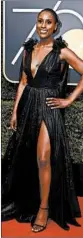  ?? JORDAN STRAUSS/INVISION/AP ?? Issa Rae in a black gown with gathered tulle at the shoulders and thigh-high split in the skirt.