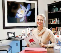  ??  ?? Stacey Ninness, president and CEO, sits in her office at Neighborho­od Services Organizati­on.