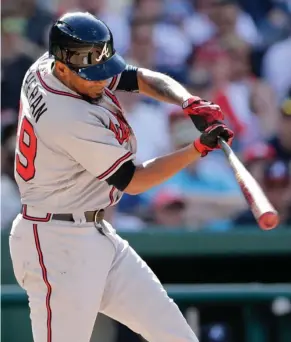  ?? (Photo by Mark Tenally, AP) ?? Atlanta Braves’ Julio Teheran hits a two-run RBI during the third inning of Saturday’s game against the Washington Nationals.