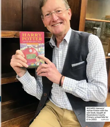  ?? SUPPLIED ?? WIZARD! Hansons’ Adrian Kinton with the rare book, bought at Ravenstone County Primary school fete for £1 in 2003