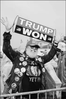  ?? KRISTIAN THACKER / THE NEW YORK TIMES ?? A supporter of former President Donald Trump attends a Republican rally May 7 in Greensburg, Pa., days before the Pennsylvan­ia primary. Numerous federal agencies agree that widely promoted falsehoods threaten the nation’s security.