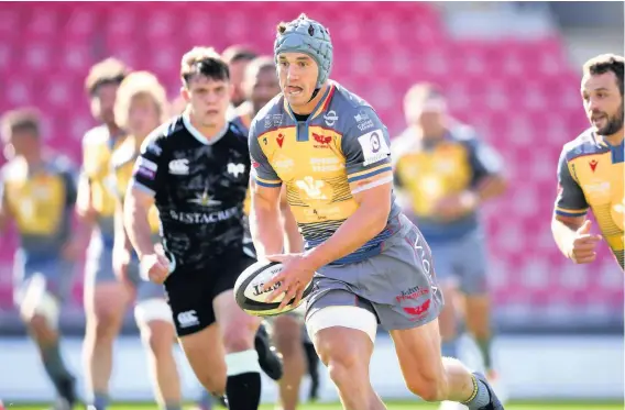  ?? Picture: Huw Evans Agency. ?? The returning Jonathan Davies looks to take on the Ospreys defence in Friday’s pre-season friendly at Parc y Scarlets.