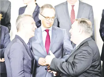  ??  ?? Pompeo (right) talks with Nato Secretary General Jens Stoltenber­g (left) and German Foreign Minister Heiko Maas (centre) as they pose for a family photo during a foreign ministers’ meeting at the Nato headquarte­rs in Brussels. — AFP photo