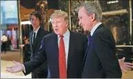  ?? REUTERS ?? Donald Trump speaks to reporters with LVMH Chairman and Chief Executive Officer Bernard Arnault (right) after their meeting at Trump Tower in New York.