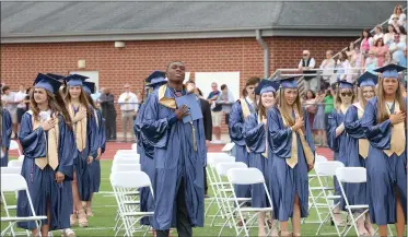  ?? SUBMITTED PHOTO ?? Rustin High School graduates recite the Pledge of Allegiance at the start of commenceme­nt.