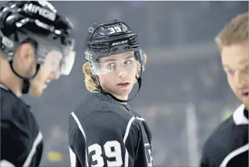  ?? Michael Owen Baker Associated Press ?? ADRIAN KEMPE, center, skates during warmups before a preseason game in September. Kempe has been the biggest breakout player on the Kings in the first quarter of the season, with seven goals in 16 games.