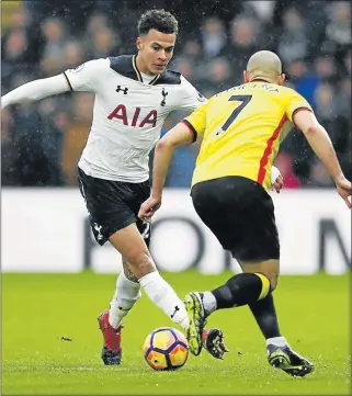  ?? Picture: REUTERS ?? TABLE ASCENT: Tottenham's Dele Alli in action with Watford’s Nordin Amrabat on New Year’s Day, a game Spurs won 4-1. Tottenham face Arsenal today, with Arsenal winning the previous encounter between the sides 2-1