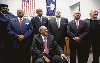  ?? Megan Gielow / For the New York Times ?? James Wells, seated, reunites with Mack C. Workman, standing left to right, Willie Edward McCleod, John Gaines, Clarence H. Graham, Willie T. Massey and Joseph Charles Jones in 2015 in Rock Hill, S.C. The conviction­s of Wells and the other members of...