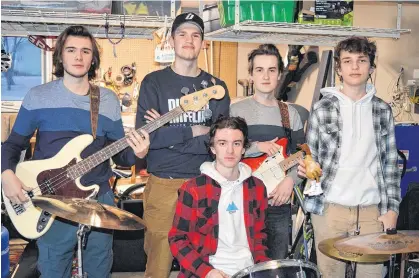  ?? DAVE STEWART • THE GUARDIAN ?? P.E.I. band The Darvel is releasing its first single from its yet unreleased and unnamed album on Friday, Jan. 15. Band members, from left, are Drew Cassibo, Sam Read, Lucas Proud (sitting), Lucas MacCormack and Malcolm Orford.
