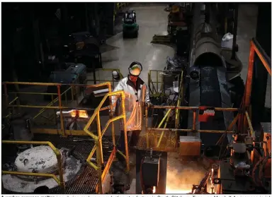  ?? (Bloomberg News WPNS/Luke Sharrett) ?? A worker oversees molten iron during cookware production at a factory in South Pittsburg, Tenn., on March 7. An increase in job openings in March was driven by retail trade and durable goods manufactur­ing.