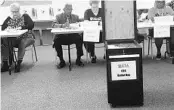  ?? ORLANDO SENTINEL ?? Members of the Orange County Classroom Teachers Associatio­n on Friday verify ballots as the union begins the process of tallying votes for the latest contract proposal.