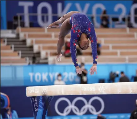  ?? CHANG W. LEE - THE ASSOCIATED PRESS ?? Simone Biles of the United States performs on the balance beam during the women’s gymnastics qualificat­ion round at the postponed 2020Tokyo Olympics in Tokyo on July 25, 2021. After withdrawin­g from most of her events at these Olympics because of mental health issues, Biles will compete in the balance beam final scheduled for Tuesday, Aug. 3, 20121, her last possible event in Tokyo.