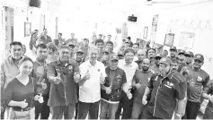  ??  ?? Lim (fifth left) and Deputy Chief Minister Datuk Seri Panglima Raymond Tan (third right) in a photo with BN supporters and members of the public during their walkabout.