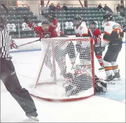  ?? JEREMY FRASER/CAPE BRETON POST ?? Robbie Harroun, middle, celebrates after jamming the puck past Aidan Ring of the Sackville Kingfisher­s as referee Jeff Covey, left, signals a goal during Panther Classic action at the Canada Games Complex, Friday. The Panthers won the game 7-0.