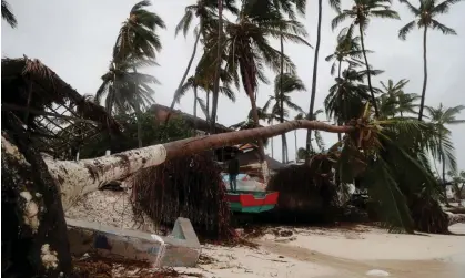  ?? Photograph: Ricardo Rojas/Reuters ?? A man stands amidst debris on the seashore in the aftermath of Hurricane Fiona in Punta Cana, Dominican Republic, on Monday.