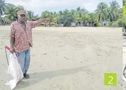  ?? Picture SOPHIE RALULU ?? 2
Kavewa islander Meli Silibaravi, 70, shows the distance from the low tide mark to the shoreline which used to be land but has been eroded by the encroachin­g sea.