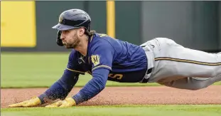  ?? AP ?? Garrett Mitchell slides into second with a double during a spring training game March 1 in Tempe, Arizona. The Brewers were thrilled that the speedy Mitchell fell to them with the 20th overall draft pick in 2020.