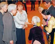  ?? Photo: EPA ?? Emperor Akihito (second left) and Empress Michiko (left).