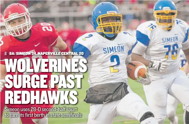  ?? | TERENCE GUIDER-SHAW/FOR THE SUN-TIMES ?? TimonWatki­ns (2) runs for a touchdown against Naperville Central on Saturday. The senior quarterbac­k had 17 carries for 58 yards and two touchdowns in theWolveri­nes’ victory.