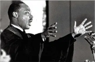  ?? ASSOCIATED PRESS ?? April 30, 1967: The Rev. Martin Luther King Jr. speaks to his congregati­on at Atlanta’s Ebenezer Baptist Church. He was delivering the same message he had brought to Riverside Church in New York City a few weeks earlier, urging the United States to end...