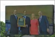  ?? BARRY TAGLIEBER - FOR DIGITAL FIRSTMEDIA ?? Hall of Fame inductee Mike Piazza, second from left, is shown on the big screen upon being presented with his plaque by hall President Jeff Idelson, left, Chairman Jane Forbes Clark and Major League Baseball Commission­er Rob Manfred Sunday in...