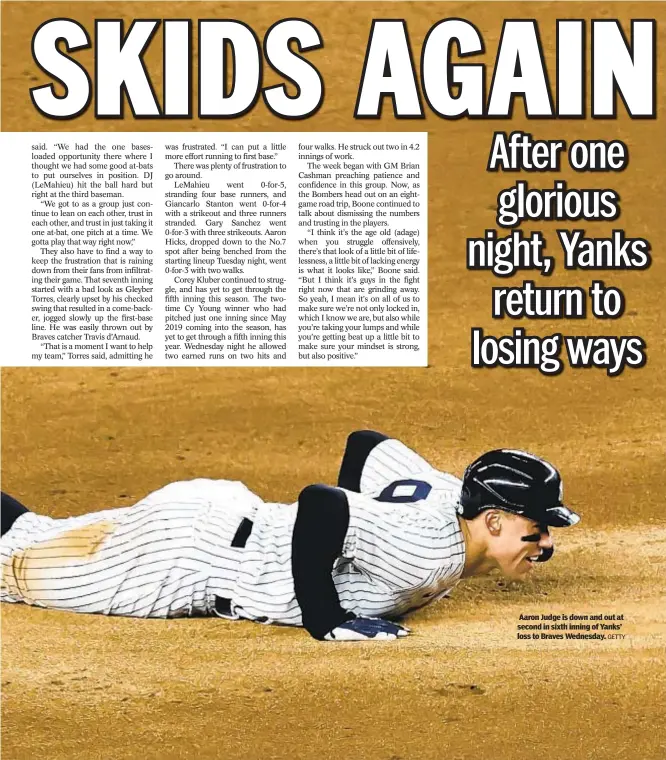  ?? GETTY ?? Aaron Judge is down and out at second in sixth inning of Yanks’ loss to Braves Wednesday.