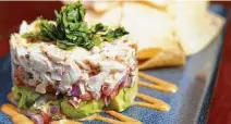  ??  ?? Brad’s Crab Stack ( jumbo lump crab salad, avocado, and citrus salad)